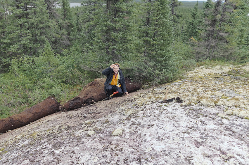 Figure 4: Mr. Rémi Charbonneau, Ph.D., P. Geo., of Inlandsis Consultants, discoverer of the Mirage lithium pegmatite field, examining a spodumene-rich outcrop