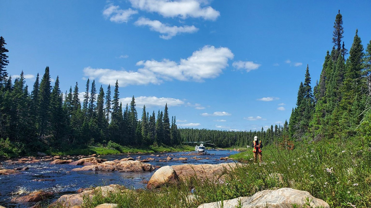 One of Brunswick Exploration’s prospecting geologists surveying a pegmatite outcrop in Labrador